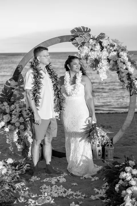 A black and white photo of their kiss at the archway