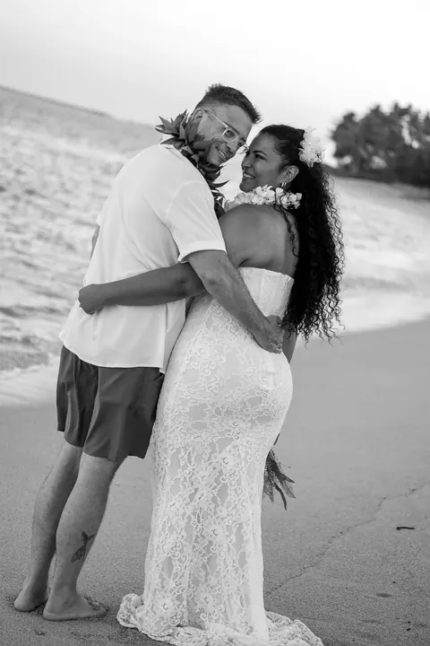 A black and white embrace on the shore