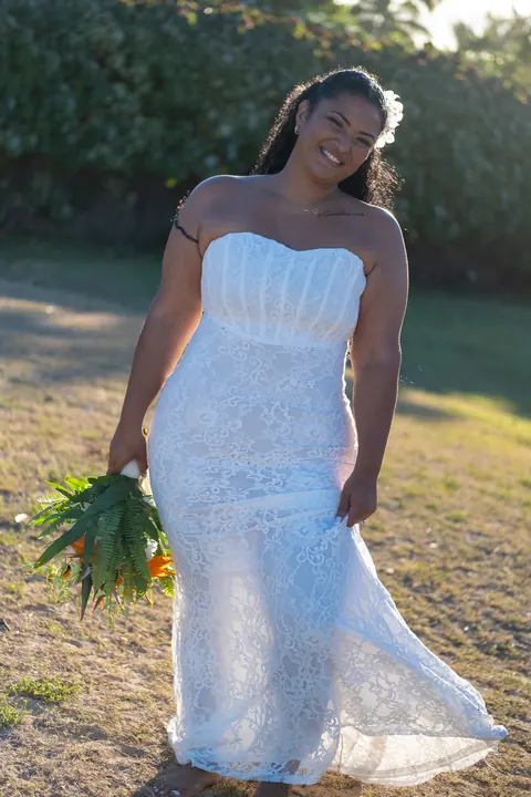 Dianna laughing as she holds her bouquet