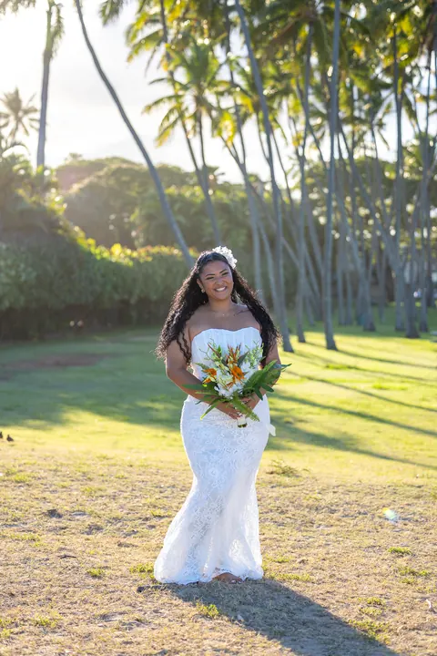 Dianna under the palms with sunlight streaming through