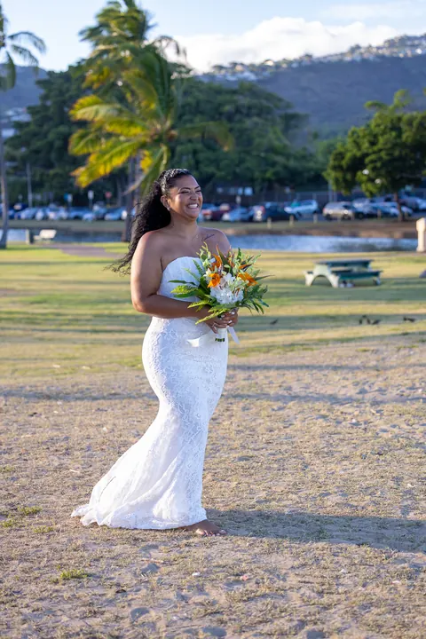 Dianna walking across the park toward the beach
