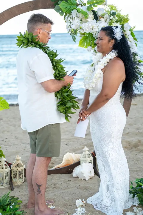 John reading his vows to Dianna