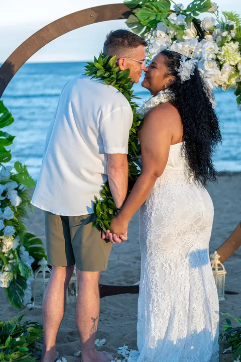 Close together at the archway by the ocean
