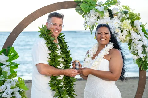 Smiling with their sand ceremony keepsake
