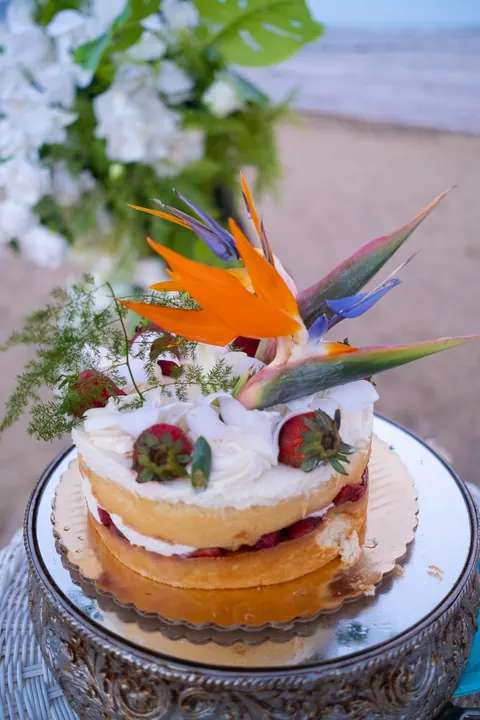The wedding cake on a silver cake stand