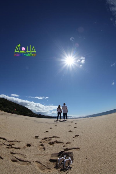 Footprints in the sand sun shining like a star