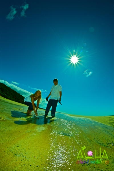 Washing her shoes in the salt water of the tide