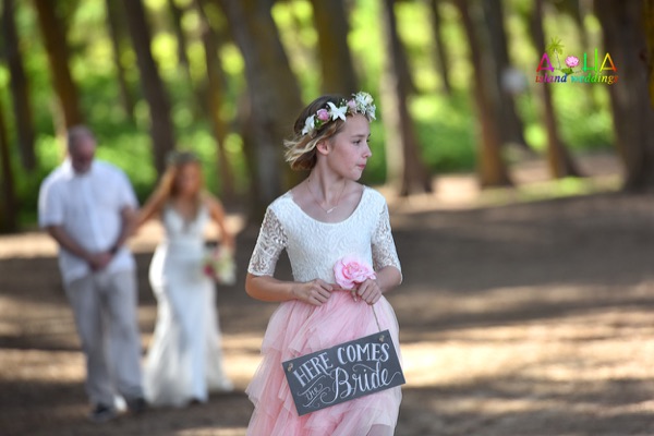 Kate and Kenny's daughter, the flower girl, with her sign