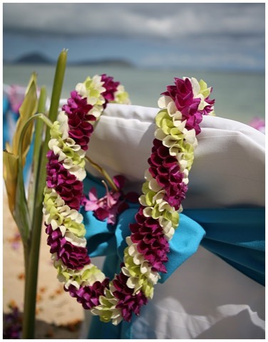 A purple Christina orchid lei for a wedding at Diamond Head