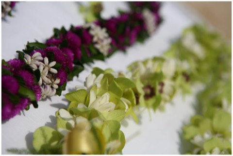 A purple orchid lei with fragrant white tuberose for a Diamond Head wedding