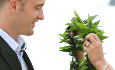 Giving the maile lei during a Hawaiian wedding ceremony