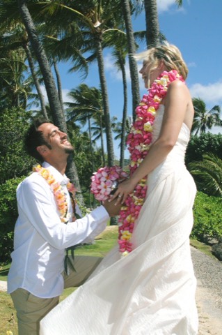 The bride in an extra long plumeria lei at the Kahala Resort