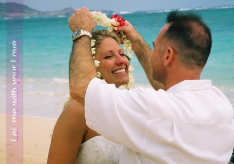 Nicole places a flower lei of love on her groom at their Oahu ceremony