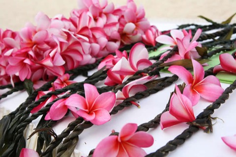 Ti leaf leis with light pink plumerias for the men at the ceremony in Hawaii