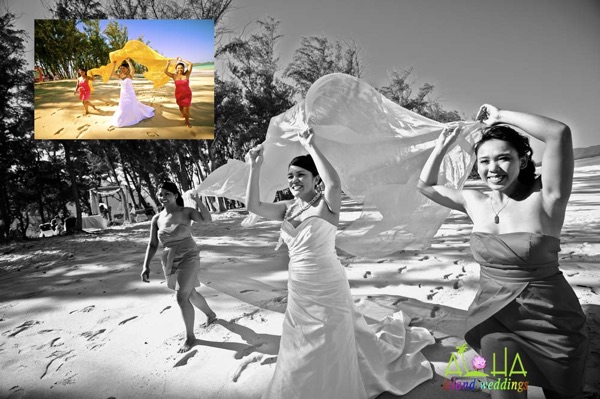 Holding bright yellow material sheer of the gazebo while walking on the beach