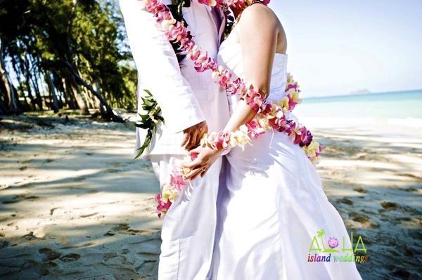 Lei around the wedding couple after their ceremony on Oahu