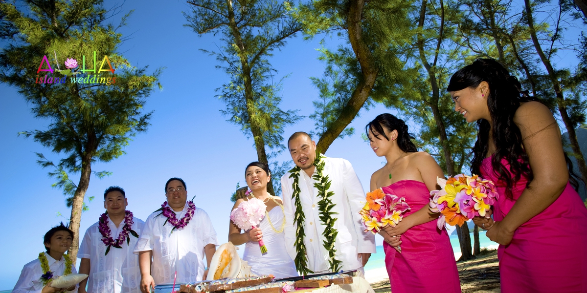 Leling and Jack celebrating on the beach after the wedding