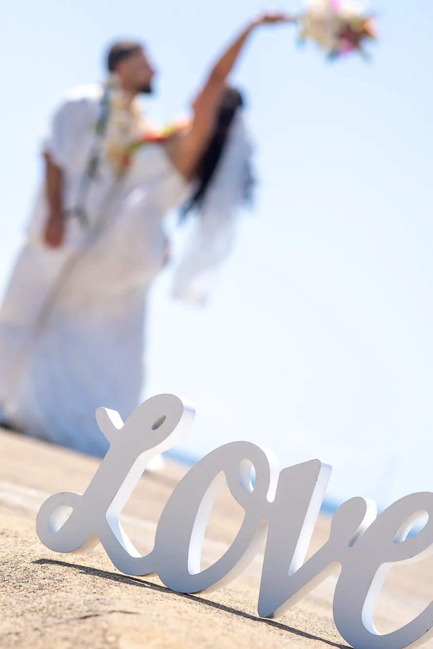 Her white gown by the water