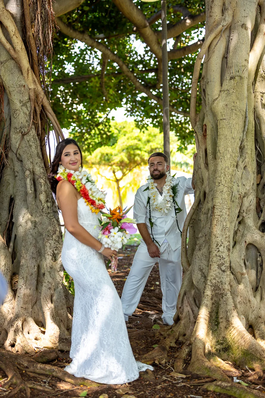 Lila and Mustafa by the banyan tree trunk
