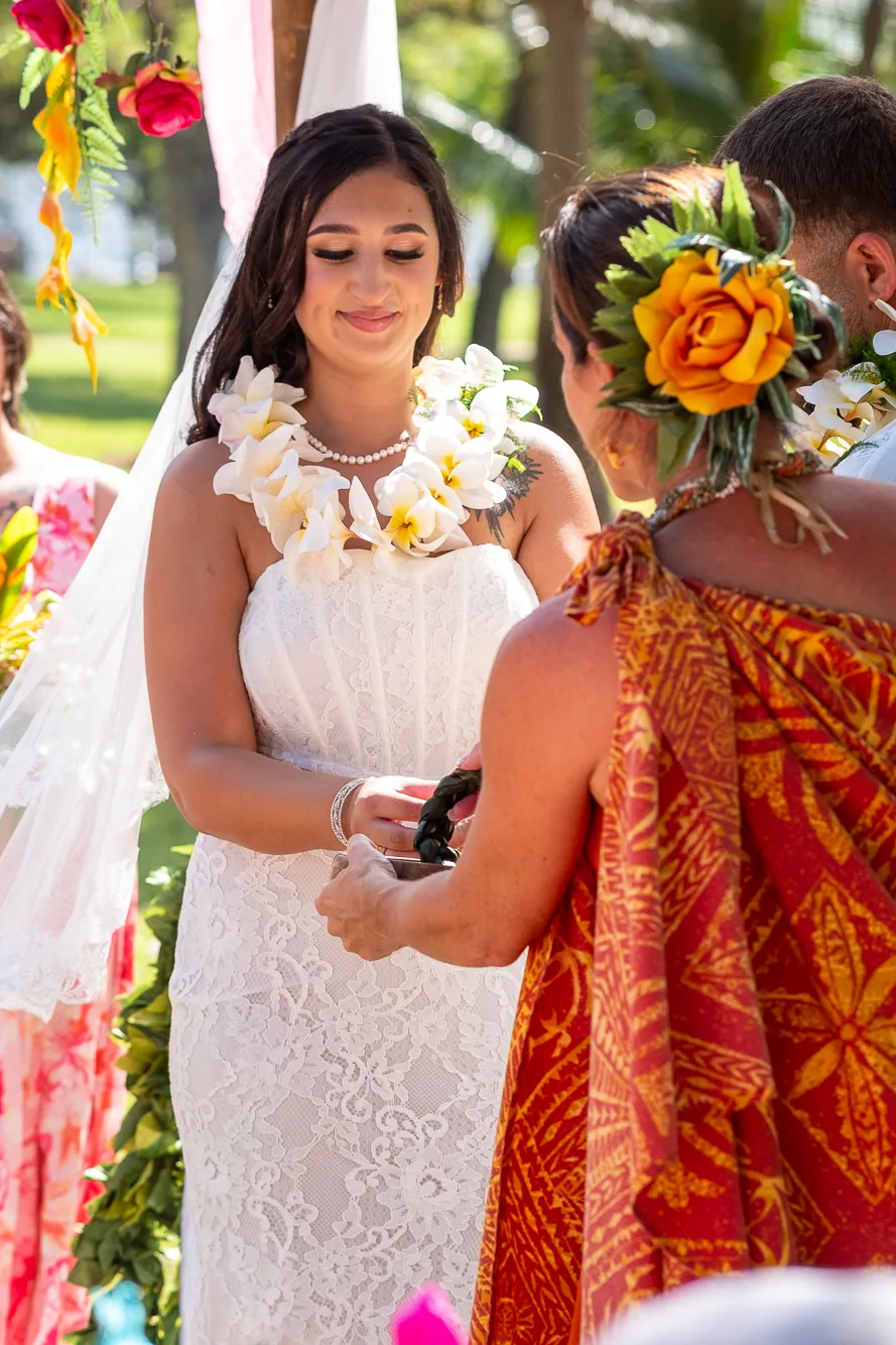 Placing a lei during the ceremony