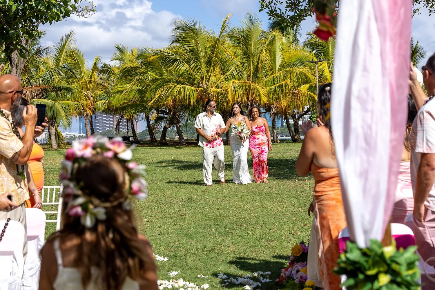 The little flower girl walking down the aisle