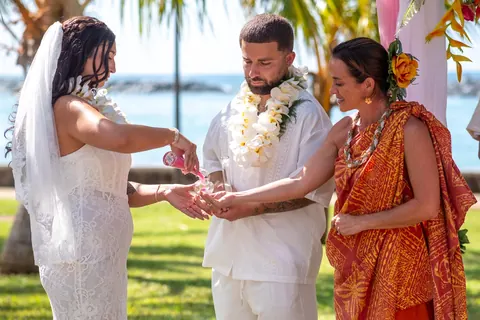 A lei exchange during the ceremony