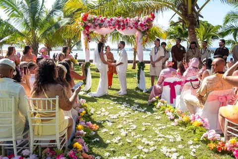 Guests waiting for the ceremony along the petal aisle