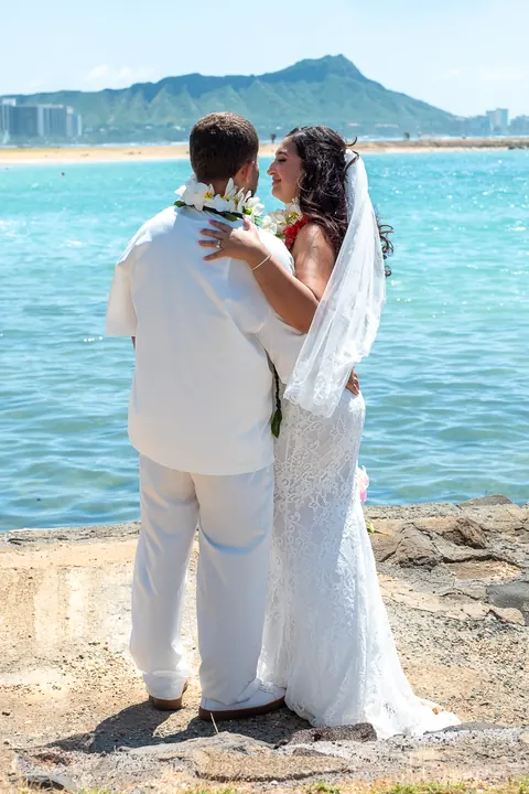 Holding hands by the ocean