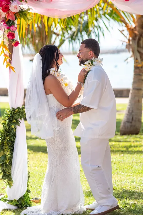 Lila and Mustafa holding hands during the vows