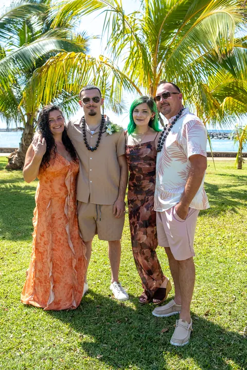 Lila and Mustafa with friends in their leis