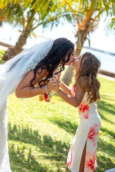 Lila kissing their daughter