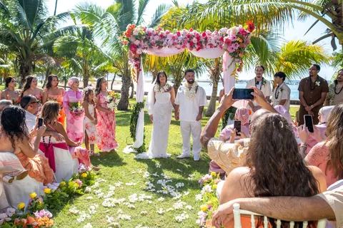 Lila walking down the aisle with her dad