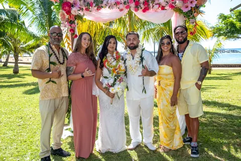 Mustafa with his groomsmen in white and tan