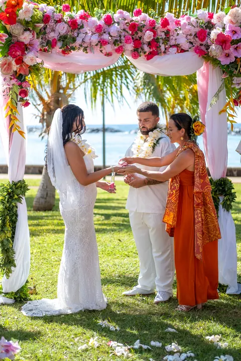 Saying their vows under the flower arch