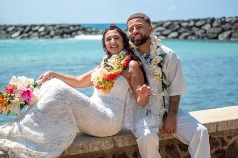 The couple relaxing on the seawall