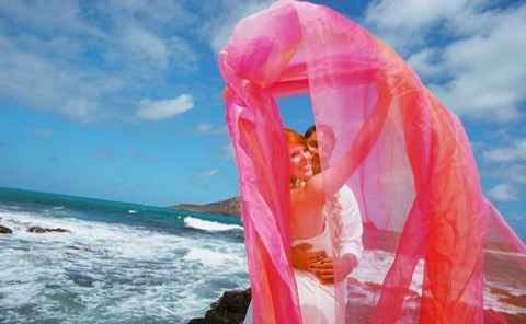 A kiss behind the pink chiffon