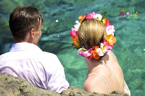 Jill in her flower crown in the turquoise water at Makapuu