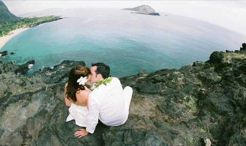 Beth and her groom kiss at the point