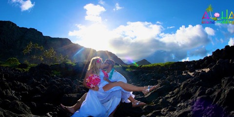 A kiss on the lava rocks at Makapuu after the wedding