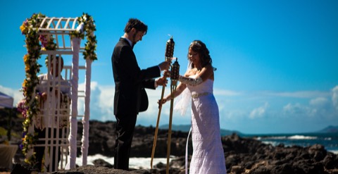 Stephanie and Ryan light the unity tiki torch at Makapuu