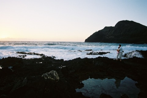 The couple on the shore with Rabbit Island in the early morning