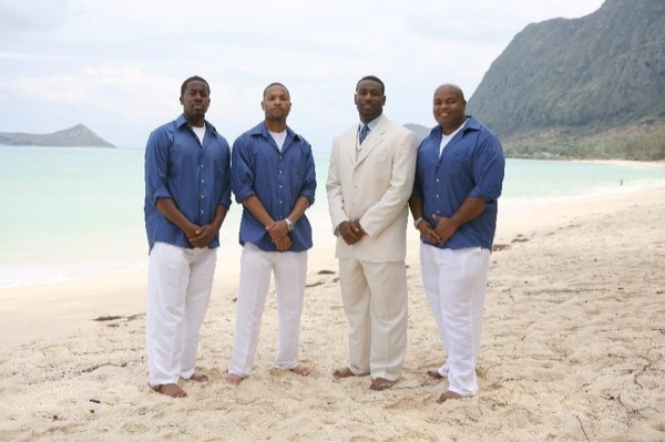 The bridal party in blue on the beach, up close