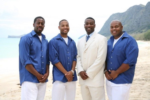 Damarus with his groomsmen in royal blue, in the afternoon light
