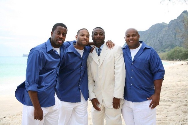 Damarus with his groomsmen in royal blue, close together