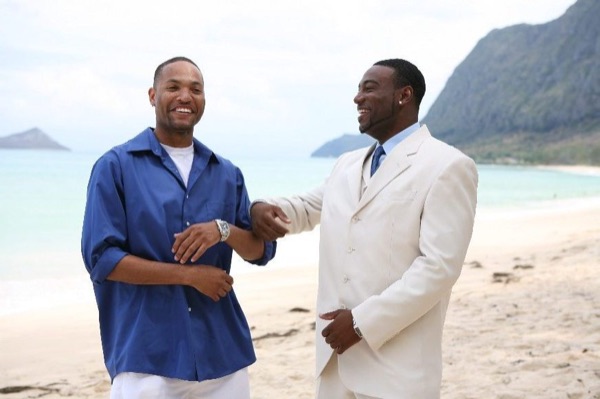 The bridal party in blue on the beach, close together