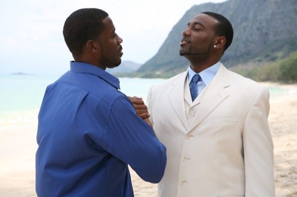 Damarus with his groomsmen in royal blue, in a happy moment