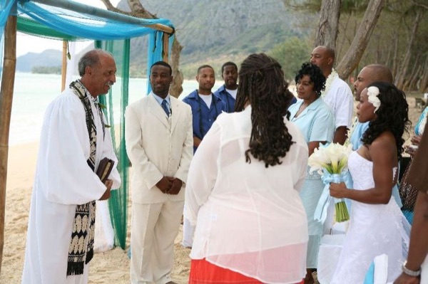Naheshae and Damarus during the ceremony, smiling