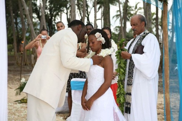 Naheshae and Damarus during the ceremony, under a blue sky