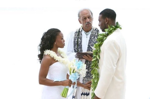 The bridal party at the ceremony, under a blue sky
