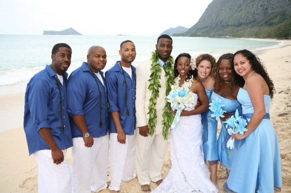 Damarus with his groomsmen in royal blue, laughing together
